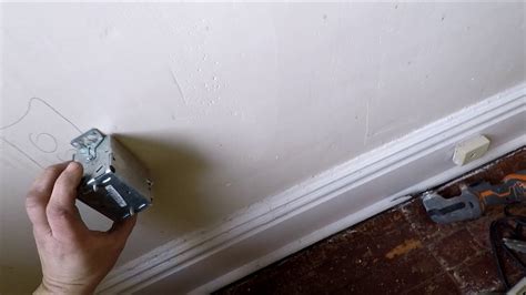 cut electrical box out of plaster|cutting in electrical box installation.